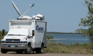 News Media on Lake Ray Roberts recording the news of zebra mussels 2012.