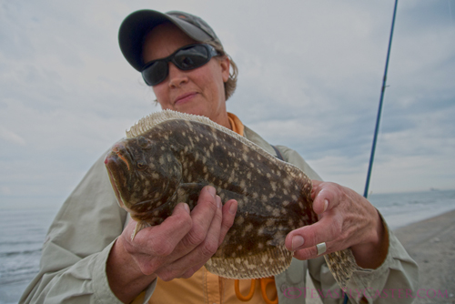 One of my guests Leslie Kregel with her flounder caught in Galveston, TX