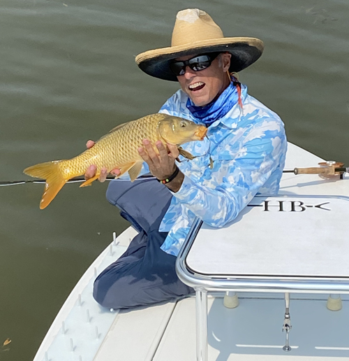 Texas fly fishing carp on fly lake ray roberts texas. Hells Bay skiff.